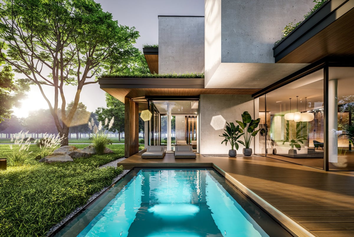Two-story house with pool and landscaping at evening